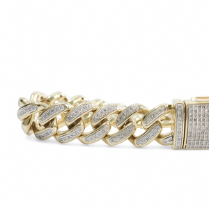 YELLOW GOLD CUBAN LINK BRACELET WITH NATURAL DIAMONDS.